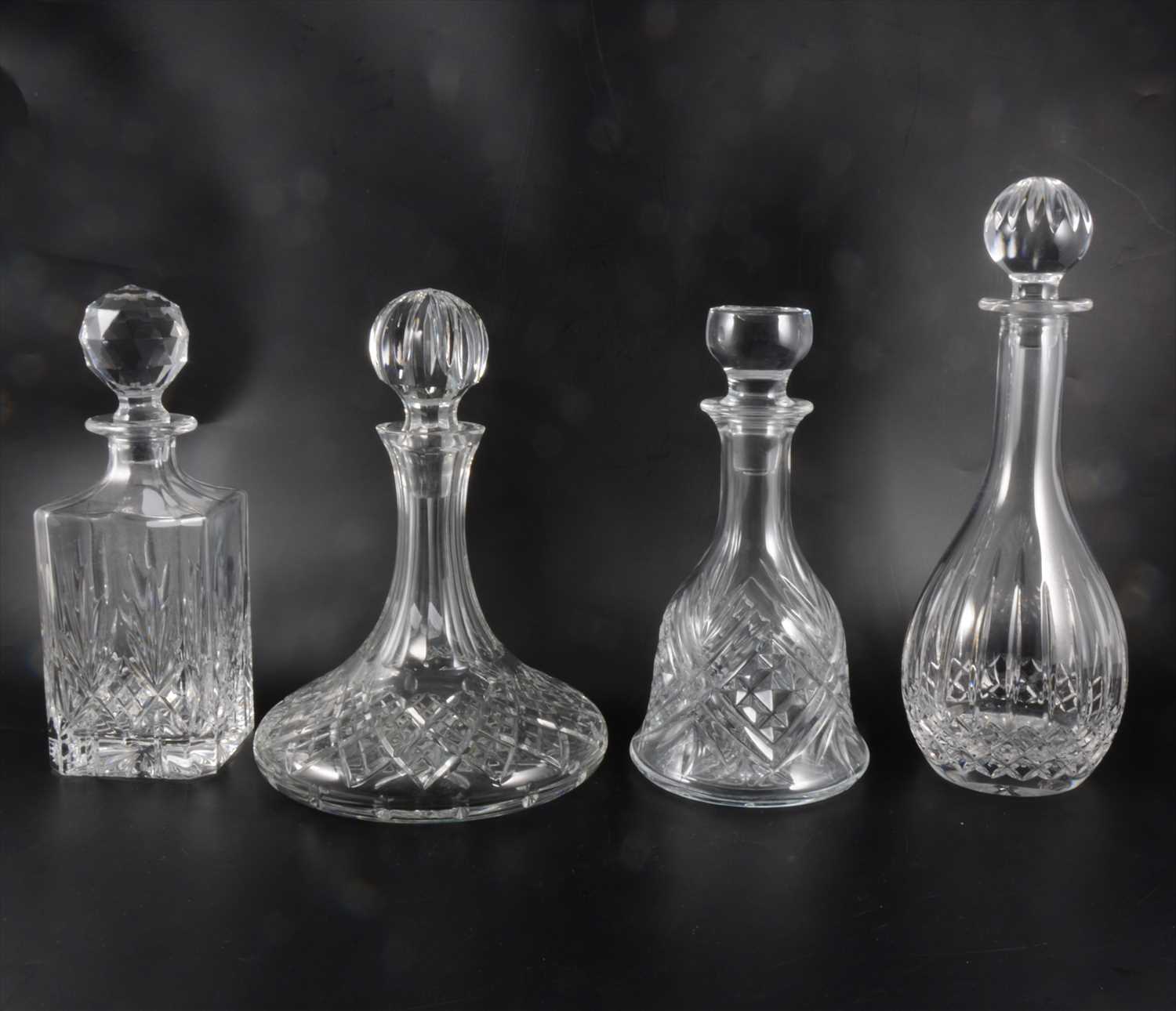 Lot 29 - Four glass decanters, including Waterfords Crystal ships decanter, another Waterfords Crystal decanter, and two others.