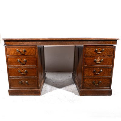 Lot 338 - An Edwardian oak twin pedestal desk