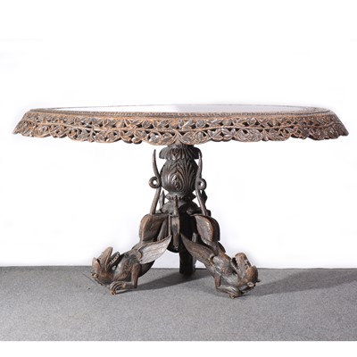 Lot 475 - A Burmese carved teak wood centre table, late 19th Century