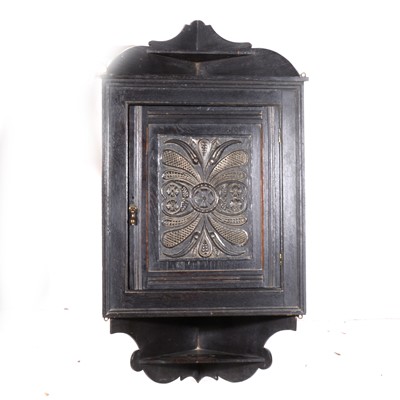 Lot 394 - A carved oak hanging corner cupboard