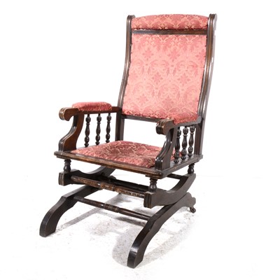 Lot 94 - An American stained wood rocking chair