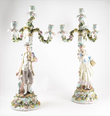 Lot 110 - A pair of Sitzendorf four-light candelabra