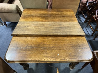 Lot 363 - A Victorian oak extending dining table