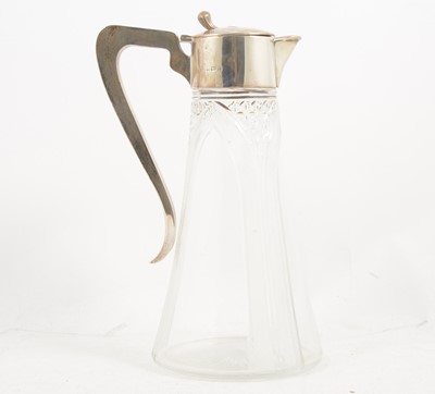 Lot 1227 - An Edwardian cut-glass and silver mounted claret jug