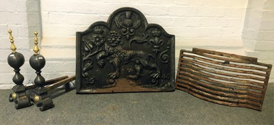 Lot 1602 - A cast iron fireback, fire grate and pair of fire dogs