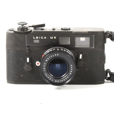Lot 165 - Leica M5 black rangefinder camera, with Leitz Wetslar 1:3.4/21 lens, serial number 1350756, in carry case and strap.