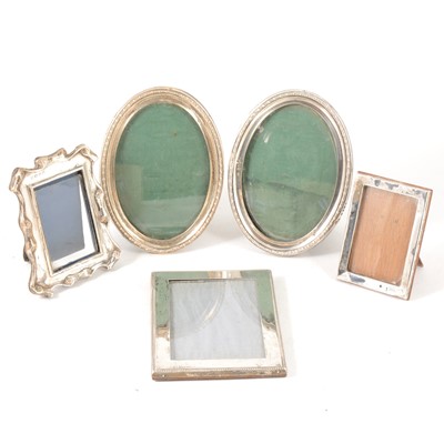 Lot 182 - Pair of oval silver photograph frames, and three other silver frames