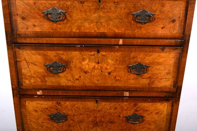 Lot 105 - A reproduction walnut finish chest on chest