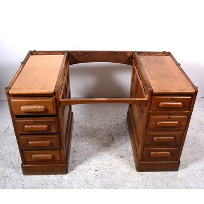 Lot 110 - An oak twin pedestal desk