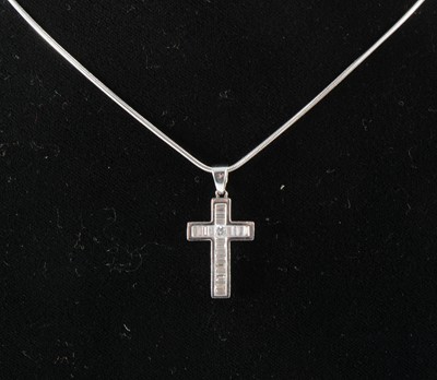 Lot 119 - A diamond cross on chain.