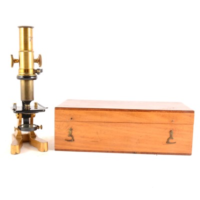 Lot 142 - A lacquered brass gilt metal monocular microscope