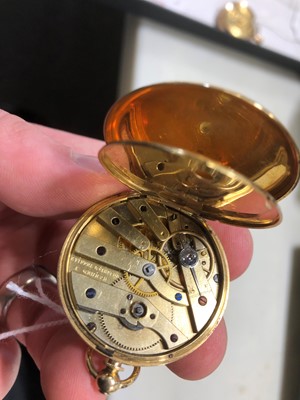 Lot 219 - A small yellow metal open face pocket watch.