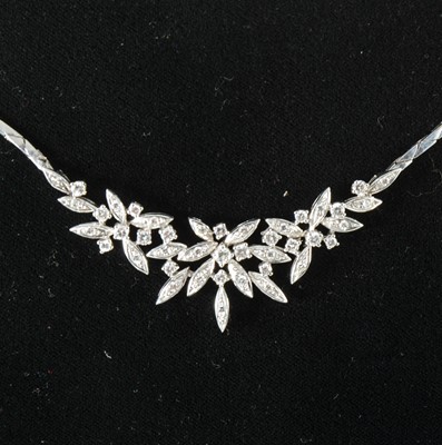 Lot 103 - A diamond set necklace.