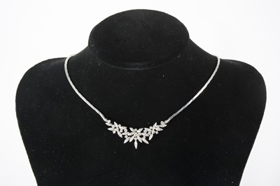 Lot 103 - A diamond set necklace.