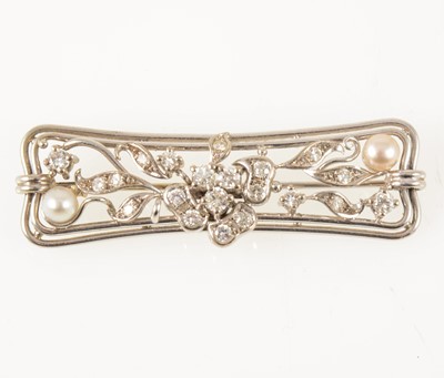 Lot 63 - A pearl and diamond bar brooch.