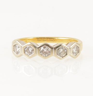 Lot 12 - A diamond five stone ring.