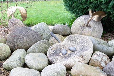 Lot 531 - Three contemporary concrete and metal rockery sculptures of fruit