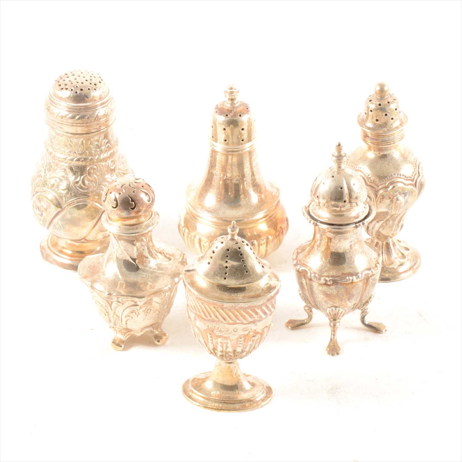 Lot 274 - A Victorian silver muffineer, and five silver pepperettes