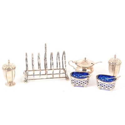 Lot 202 - A six section silver toast rack, and other silver cruets and pepperettes