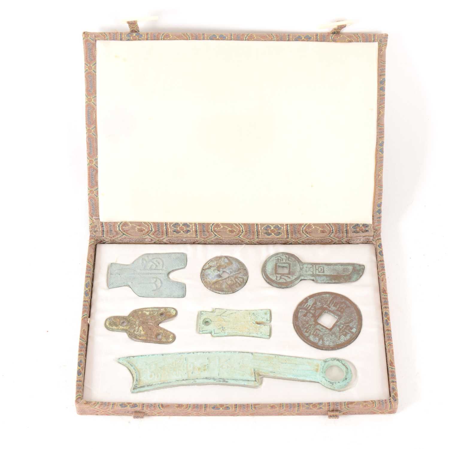 Lot 162 - A collection of seven Chinese archaic style cast metal artefacts