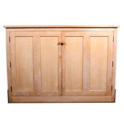 Lot 1588 - A limed oak two-door linen cupboard