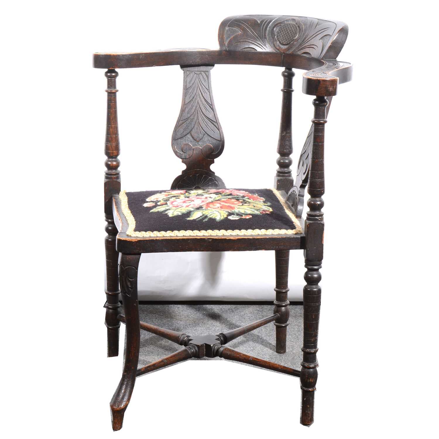 Lot 58 - A Victorian carved oak corner chair