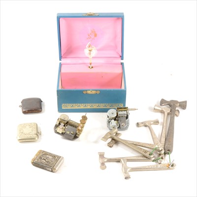 Lot 205 - Two trays to include plated vesta cases, toffee hammers, bottle openers, sovereign case, musical jewellery boxes and loose musical mechanisms.
