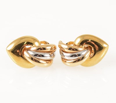 Lot 57 - A pair of 18 carat yellow and white gold earrings.