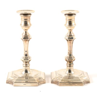 Lot 212 - A pair of Georgian style silver candlesticks, Harrods, Birmingham 1965