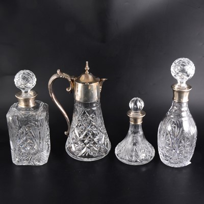 Lot 20 - Three silver mounted crystal decanters, a silver tray, and cut-crystal and plated mounted claret jug