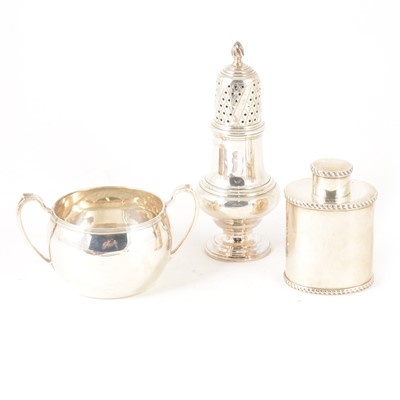 Lot 194 - A small silver caddy with gadroon edge, sugar caster and twin handled bowl