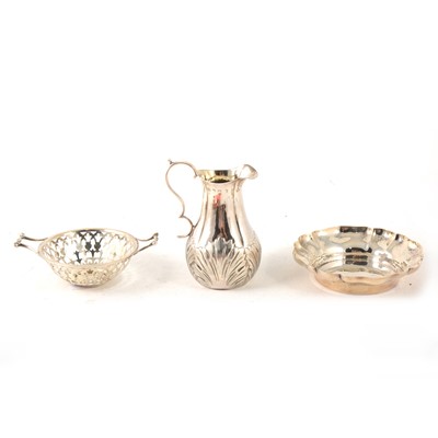 Lot 220 - A silver jug with acanthus leaf border, fluted bonbon dish and another small pierced dish.