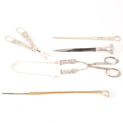 Lot 225 - Three paperknives, two pairs of  tongs, grape scissors.