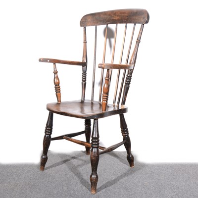 Lot 531 - A beech and elm Windsor type farmhouse elbow chair