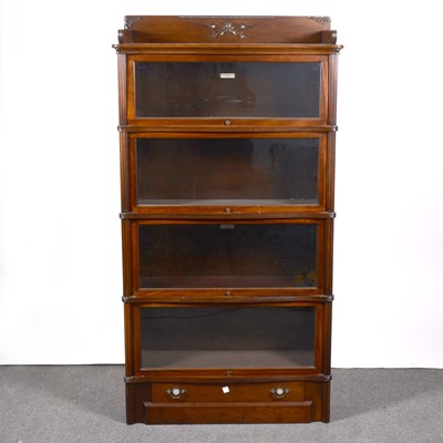 Lot 486 - An American walnut sectional bookcase, The Globe-Wernicke Co Limited