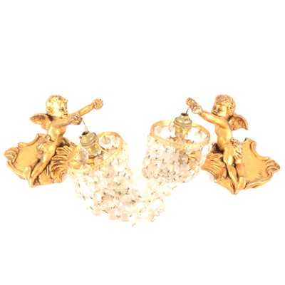 Lot 108 - A pair of modern gilded cherub wall lights with glass lustres.