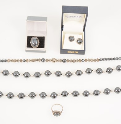 Lot 373 - A collection of haematite jewellery, two necklaces, two rings, earrings and silver earrings.