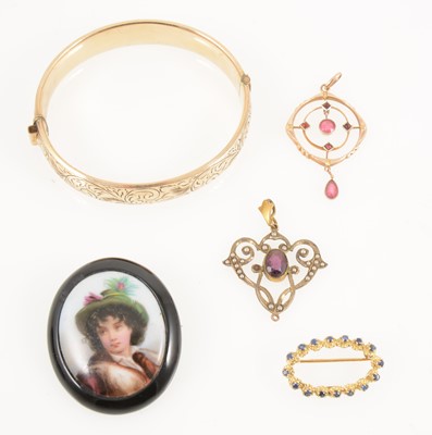 Lot 1338 - A collection of vintage pendants, brooch and bangle.