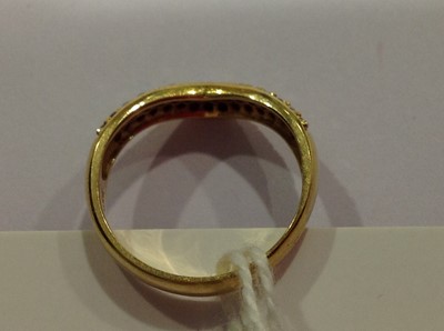 Lot 17 - A diamond set wishbone ring.