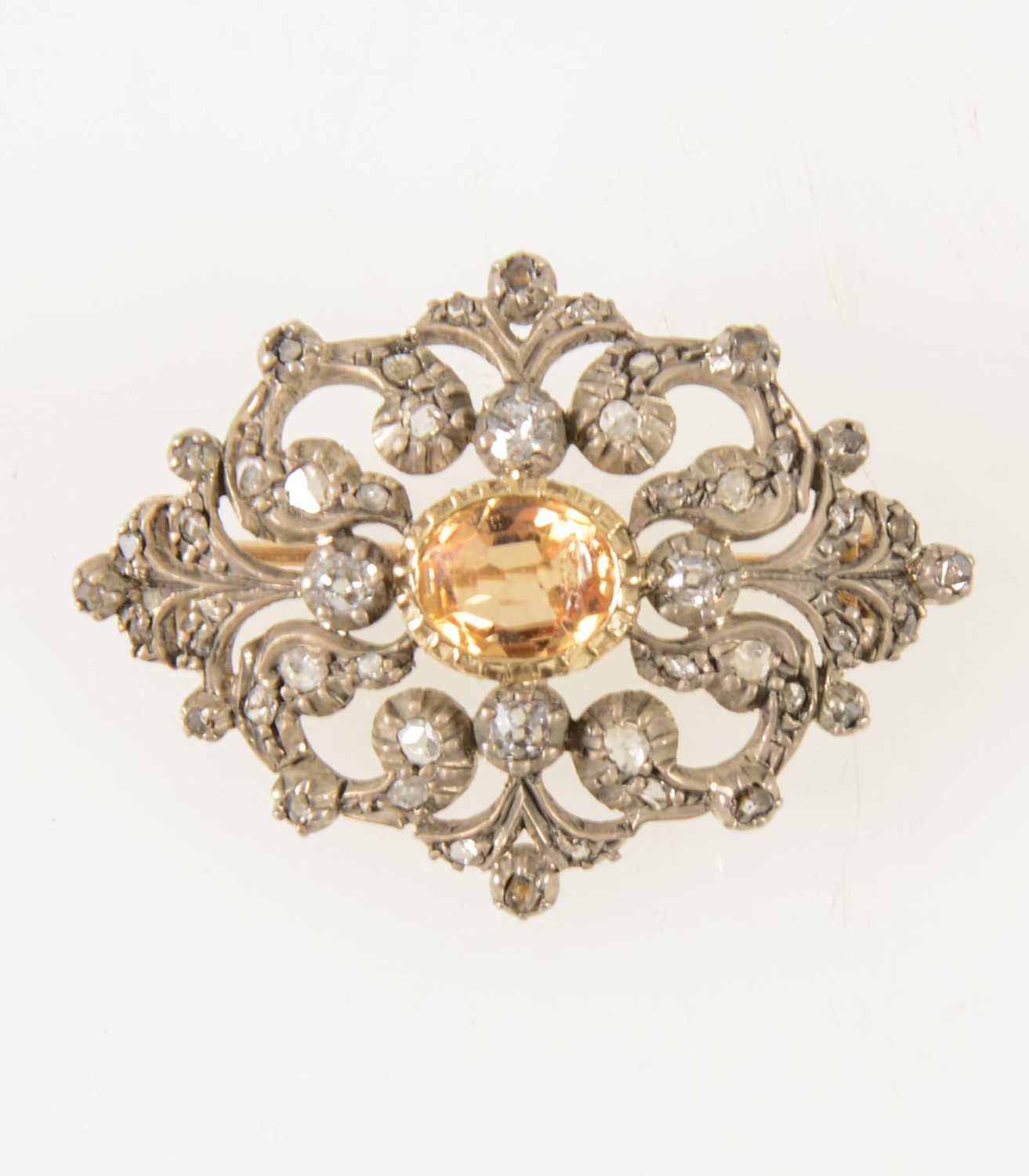 Lot 66 - A late Victorian diamond brooch with golden yellow stone to centre