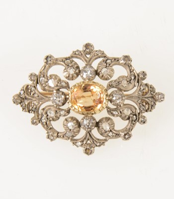 Lot 66 - A late Victorian diamond brooch with golden yellow stone to centre