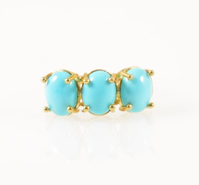 Lot 39 - A turquoise three stone ring.