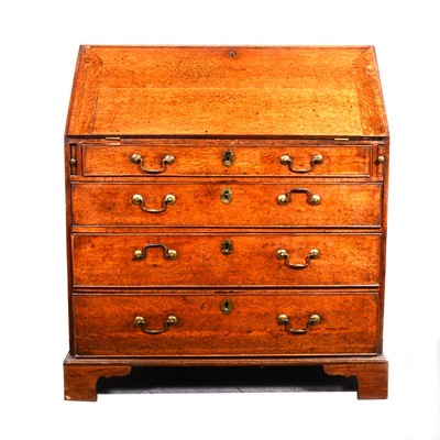 Lot 1517 - A Georgian oak bureau