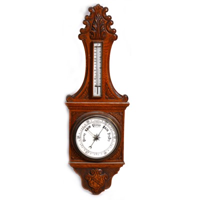 Lot 1575 - A VIctorian carved oak case barometer