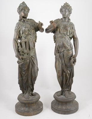 Lot 1095 - Pair of spelter patinated figures of muses,...