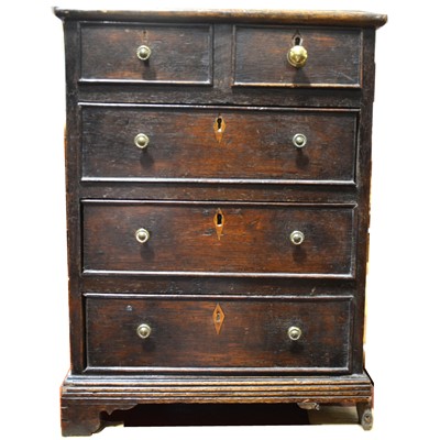 Lot 1533 - A 19th Century miniature oak chest of drawers