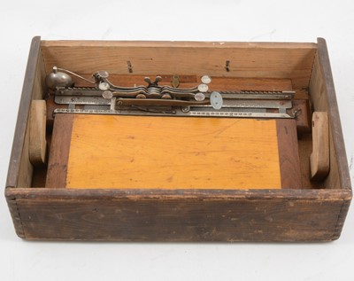 Lot 1106 - A braille typewriter, in a pine box, 38cm.