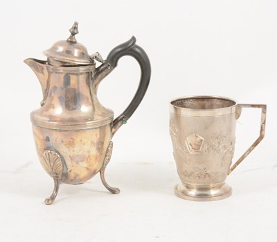Lot 1184 - A small silver hot water jug and a sterling silver mug