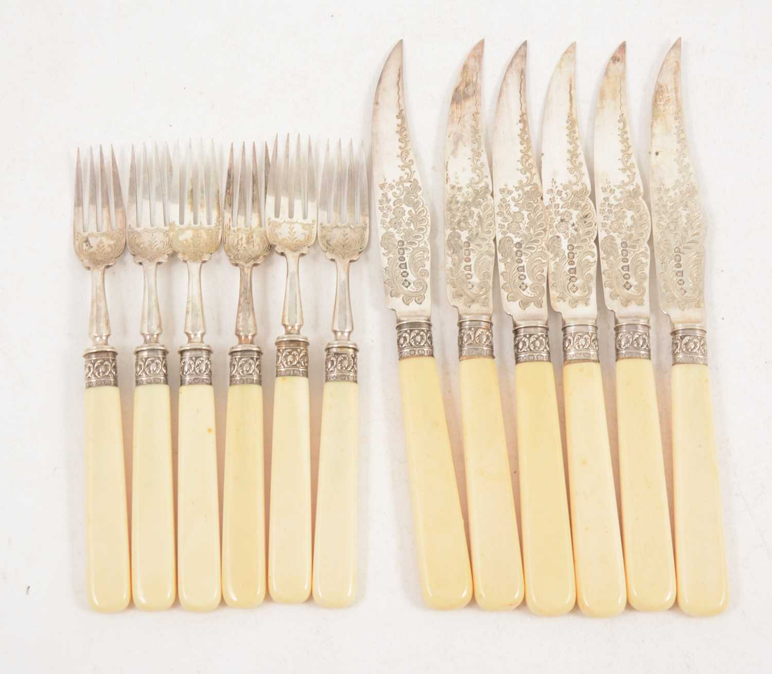 Lot 1220 - A set of six silver plated dessert knives and forks