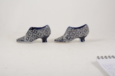Lot 13 - A pair of Continental porcelain miniature shoes